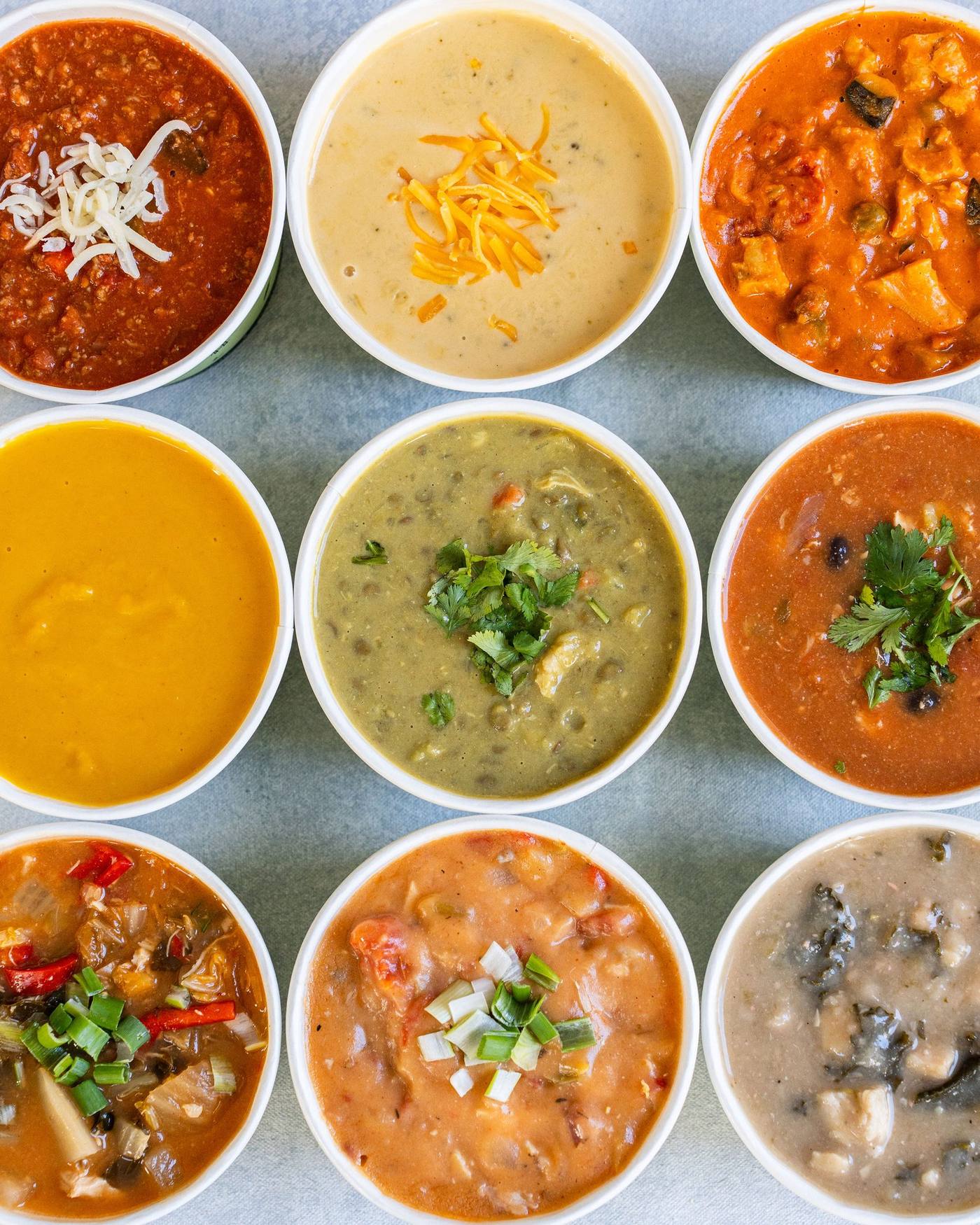 Nine varieties of soup arranged in a grid