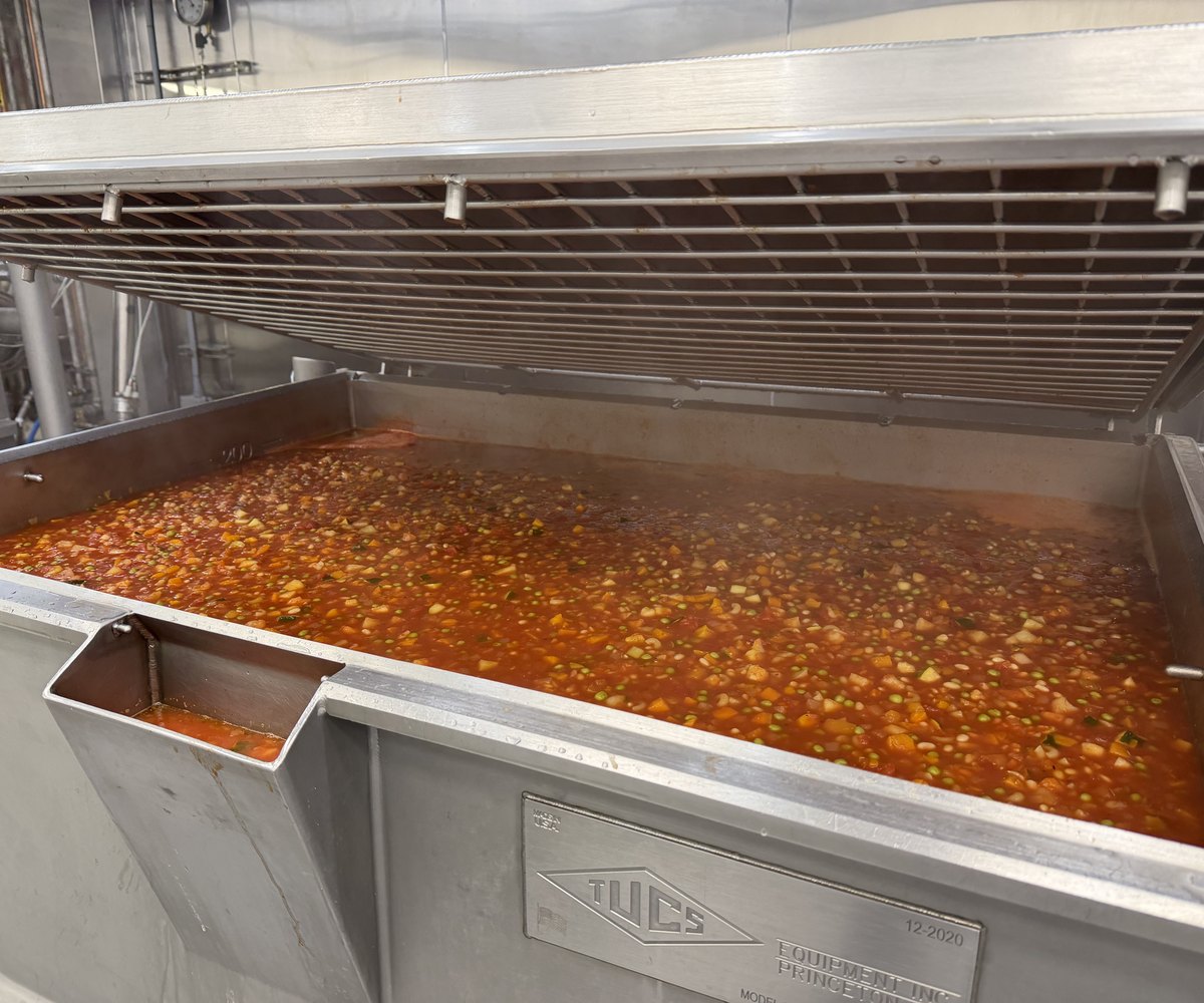 A production kettle of minestrone at full batch volume